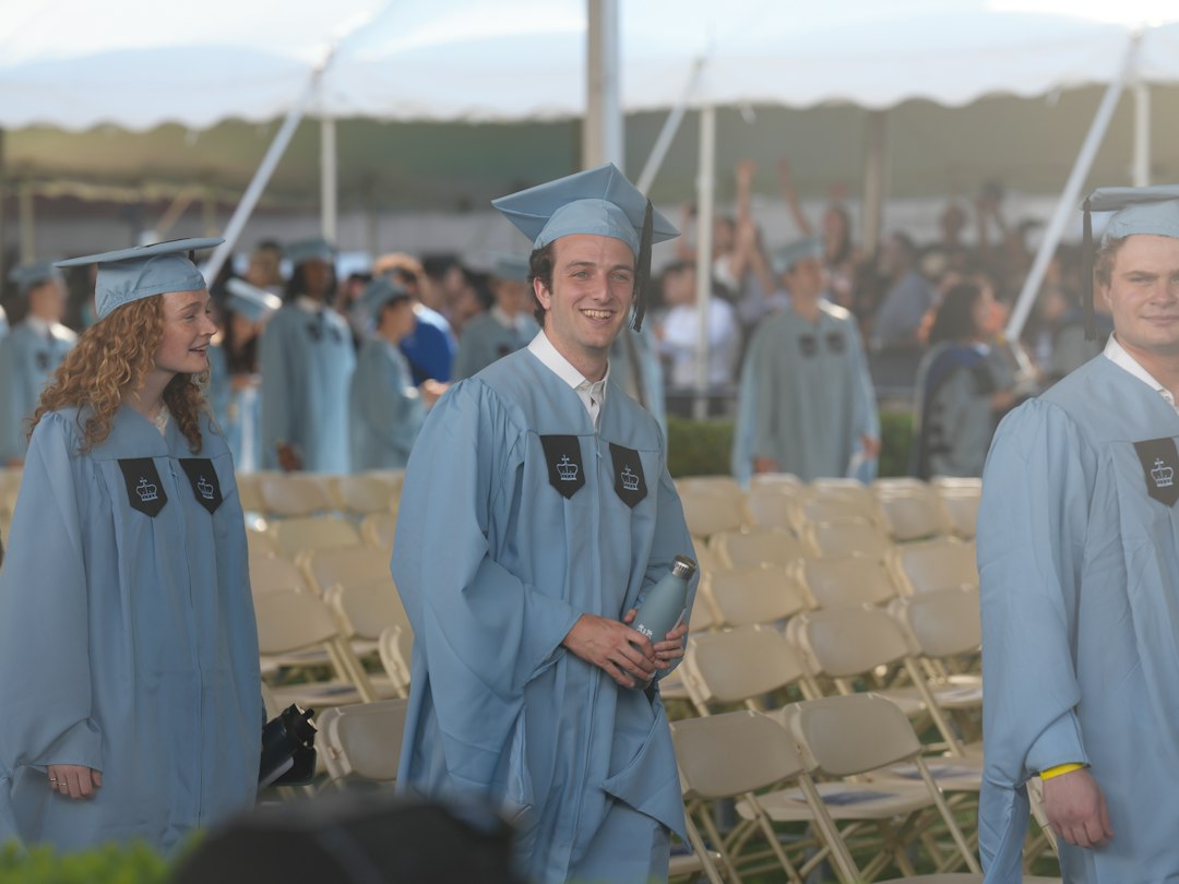 Smiling graduate in cap and gown